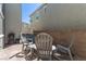Relaxing patio with chairs, table, and barbecue grill, ideal for outdoor living at 2901 Bahama Yellow Ave, North Las Vegas, NV 89086