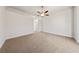 Bedroom showcasing neutral carpeting and a ceiling fan at 3033 Bonnie Rock Dr, Las Vegas, NV 89134
