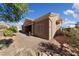 Exterior view of home with desert landscaping at 3033 Bonnie Rock Dr, Las Vegas, NV 89134