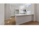Modern kitchen featuring white cabinets, quartz countertops, and stainless steel appliances at 3033 Bonnie Rock Dr, Las Vegas, NV 89134