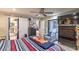 Bedroom featuring stylish decor, ceiling fan and access to the ensuite bath at 3053 Conquista Ct, Las Vegas, NV 89121