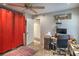 Bedroom with desk and ceiling fan, offering a comfortable and functional space at 3053 Conquista Ct, Las Vegas, NV 89121