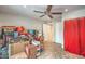 Bedroom or bonus room with boxes, sliding door and red curtains at 3053 Conquista Ct, Las Vegas, NV 89121