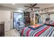 Bright bedroom with sliding glass doors leading to an outdoor area at 3053 Conquista Ct, Las Vegas, NV 89121