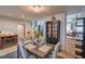 Cozy dining room featuring a modern table setting, tile flooring, and stylish décor at 3053 Conquista Ct, Las Vegas, NV 89121