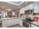 Modern kitchen featuring stainless appliances and white cabinets at 3053 Conquista Ct, Las Vegas, NV 89121