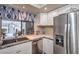 Bright kitchen with stainless steel appliances and a window with a view at 3053 Conquista Ct, Las Vegas, NV 89121