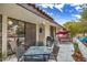 Outdoor patio with seating area, grill and lush landscaping providing outdoor enjoyment at 3053 Conquista Ct, Las Vegas, NV 89121