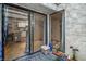 A patio viewed from inside through a glass sliding door, showcasing an entry area at 3053 Conquista Ct, Las Vegas, NV 89121