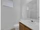 Bright bathroom with a wood vanity, large mirror, and a shower-tub combination at 3525 Hammock St, Las Vegas, NV 89147