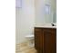 Bathroom featuring a modern vanity with dark wood cabinets and a sleek faucet fixture, complemented by a mirror at 3525 Hammock St, Las Vegas, NV 89147