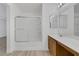 Bathroom view with tub and shower, plus a modern vanity offering lots of storage space at 3525 Hammock St, Las Vegas, NV 89147
