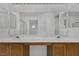 Bright bathroom featuring a double vanity with modern sinks and a large mirror at 3525 Hammock St, Las Vegas, NV 89147