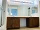 Bright bathroom vanity featuring dual sinks, large mirror, and stylish fixtures at 3525 Hammock St, Las Vegas, NV 89147