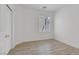 Neutral bedroom with a closet, wood-look floors, and natural light at 3525 Hammock St, Las Vegas, NV 89147