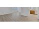 Large bedroom with light wood-look flooring and en suite bathroom at 3525 Hammock St, Las Vegas, NV 89147
