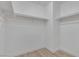 Walk-in closet featuring an open storage rack, white walls and light wood-look floor at 3525 Hammock St, Las Vegas, NV 89147