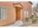 Exterior view of the front door with stone landscaping and security screen at 3525 Hammock St, Las Vegas, NV 89147