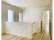 Hallway with natural light, wood-look floors, and access to a bedroom at 3525 Hammock St, Las Vegas, NV 89147