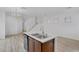 Open-concept kitchen with a center island and adjacent living space, great for entertaining at 3525 Hammock St, Las Vegas, NV 89147