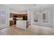 Eat-in kitchen with dark wood cabinets, a center island, and stainless steel appliances at 3525 Hammock St, Las Vegas, NV 89147