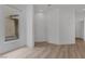 Bright living room featuring wood-look floors, a window, and neutral wall color at 3525 Hammock St, Las Vegas, NV 89147
