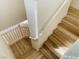 Well-lit staircase features wood-style flooring, and white banister at 3525 Hammock St, Las Vegas, NV 89147