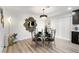 Elegant dining room with decorative mirror, chandelier lighting, and unique chair designs at 3645 E Viking Rd, Las Vegas, NV 89121