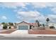 Charming single-story home features a low-pitched roof, a two-car garage, and a manicured gravel front yard at 3645 E Viking Rd, Las Vegas, NV 89121