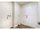 Bright laundry room with white walls, practical flooring, and a neatly installed utility setup at 3645 E Viking Rd, Las Vegas, NV 89121