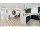 Bright open-plan living space seamlessly connecting the living room, dining, and kitchen at 3645 E Viking Rd, Las Vegas, NV 89121