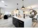 Open-concept living spaces including a modern kitchen island, dining area, and comfortable living room at 3645 E Viking Rd, Las Vegas, NV 89121