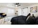 Comfortable main bedroom featuring a ceiling fan, neutral decor, and natural light from the window at 3645 E Viking Rd, Las Vegas, NV 89121