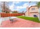 Backyard featuring a patio, table, barbecue, green grass, and wood fence at 3744 Archer St, Las Vegas, NV 89108