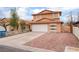 Charming two-story home boasts a spacious driveway, two-car garage, and well-kept front yard at 3744 Archer St, Las Vegas, NV 89108