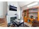 Inviting living room features fireplace, modern decor, a tv, and a wooden entertainment center at 3744 Archer St, Las Vegas, NV 89108
