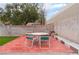 Outdoor patio features a dining table with seating for four within a fenced yard at 3744 Archer St, Las Vegas, NV 89108