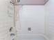 Bathroom featuring a white tiled shower with a mounted shower head and soap dish at 3744 Archer St, Las Vegas, NV 89108