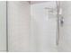 Bathroom featuring a white tiled shower with a mounted shower head at 3744 Archer St, Las Vegas, NV 89108