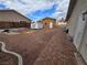 The backyard features a mix of gravel, pavers and a small outbuilding at 4342 E Russell Rd, Las Vegas, NV 89120