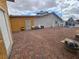 Spacious backyard offers a blend of brick pavers and gravel, creating a functional outdoor space at 4342 E Russell Rd, Las Vegas, NV 89120