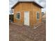 Exterior shot of outbuilding featuring white door and windows at 4342 E Russell Rd, Las Vegas, NV 89120