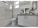 Modern bathroom with a glass-enclosed shower, marble countertop vanity, and sleek fixtures, exuding elegance at 5029 Alfingo St, Las Vegas, NV 89135