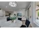 A dining area next to sliding doors allows natural light to fill the space with views into the kitchen and living area at 5029 Alfingo St, Las Vegas, NV 89135