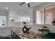 Dining area with hardwood floors, neutral paint, and a modern light fixture at 5029 Alfingo St, Las Vegas, NV 89135