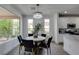 Bright dining area featuring a modern chandelier and sleek, comfortable chairs at 5029 Alfingo St, Las Vegas, NV 89135