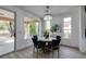 Elegant dining room with stylish chandelier, comfortable seating, and bright natural light at 5029 Alfingo St, Las Vegas, NV 89135
