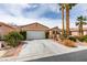 Charming single-story home with a two-car garage, desert landscaping and a private gated front entry at 5029 Alfingo St, Las Vegas, NV 89135