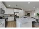 Modern kitchen features stainless steel appliances, an island with marble countertop, and open floor plan at 5029 Alfingo St, Las Vegas, NV 89135