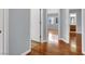 Bedroom featuring hardwood flooring, a neutral paint color and access to bathroom at 5246 Aurora Beam Ave, Las Vegas, NV 89122